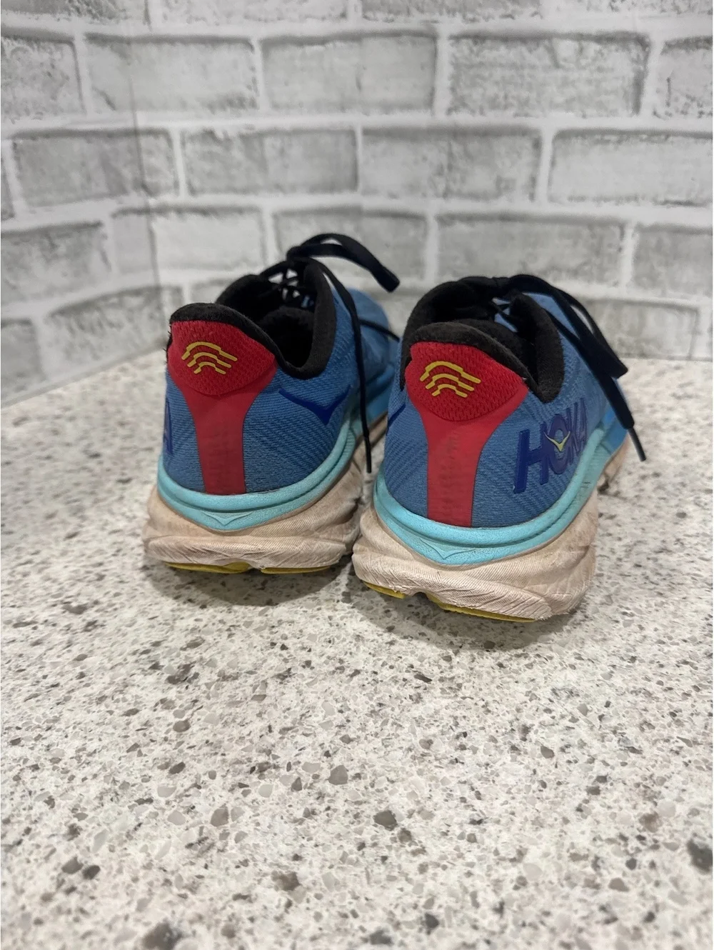 Hoka Clifton 9 Men's Blue Running Shoes with Yellow Accents, Size 10.5 D